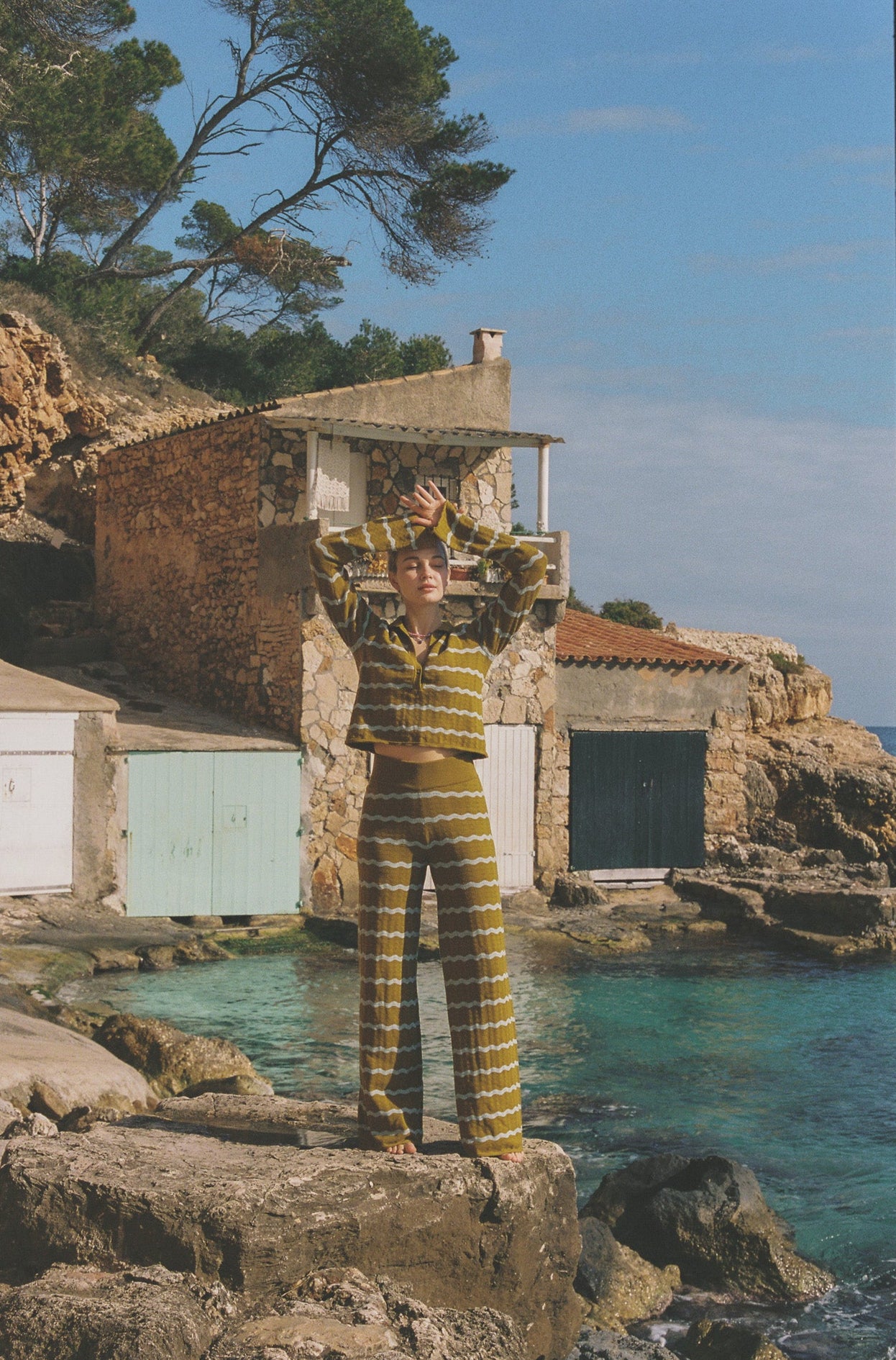 Person in striped yellow and white matching outfit set.