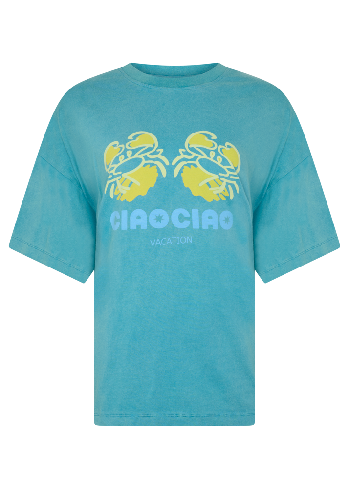 Blue t-shirt with yellow crab design and 'CIAO CIAO' branding text on a white background