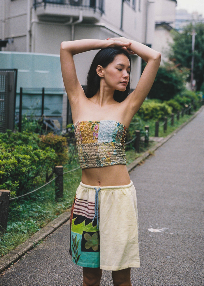 Woman in the streets wearing a colorful patchwork bandeau top