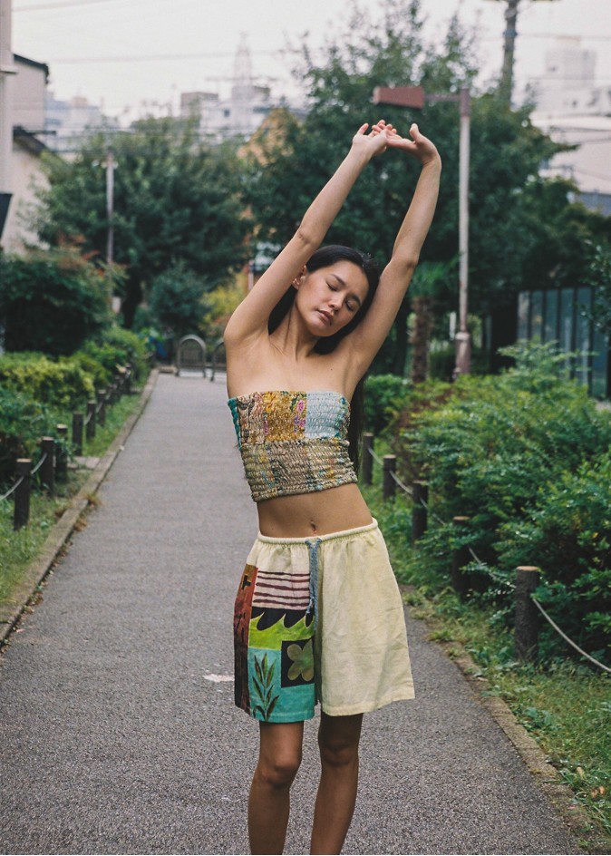 Woman in the streets wearing a colorful patchwork bandeau top