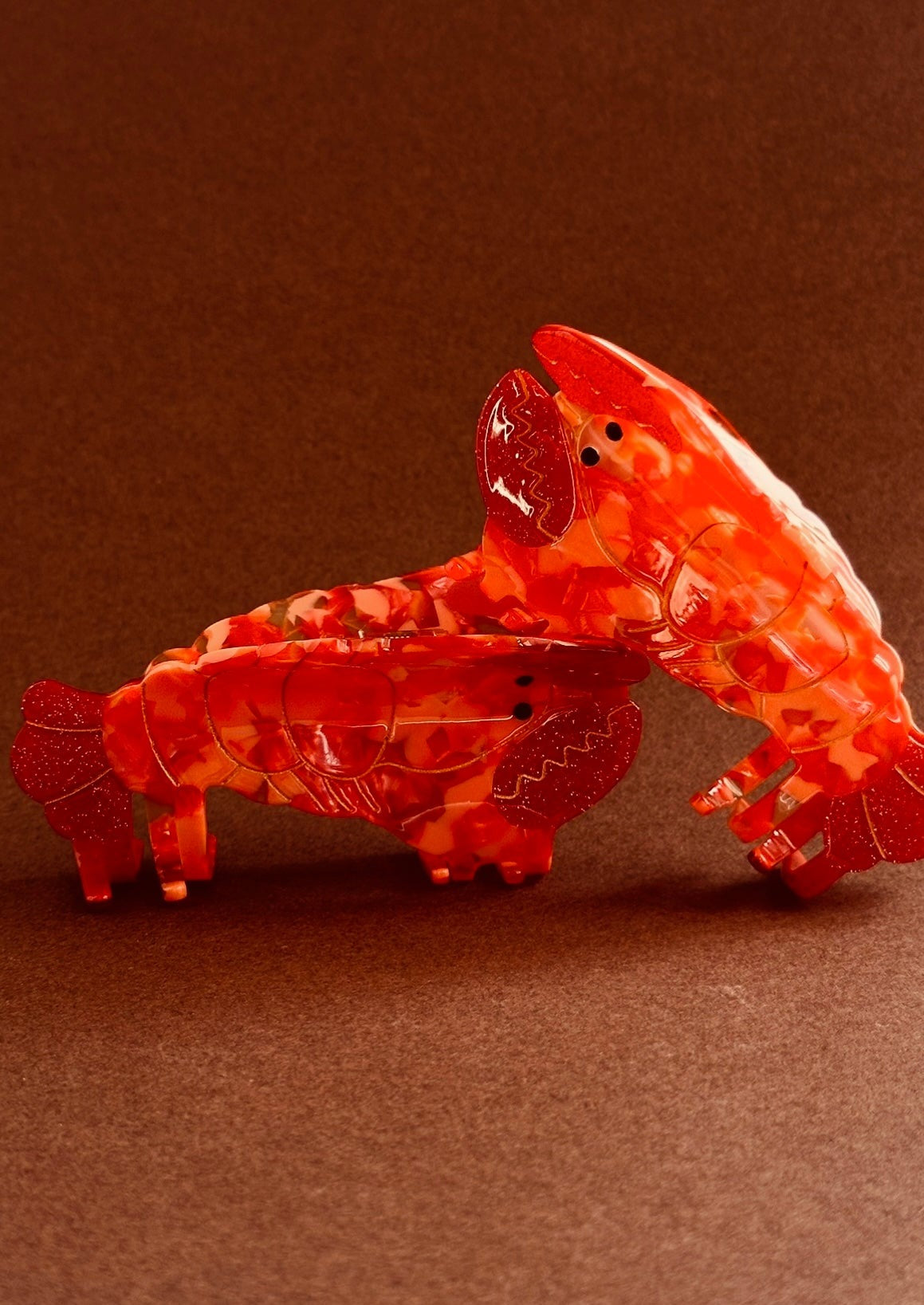 A red and orange plastic hair claw.