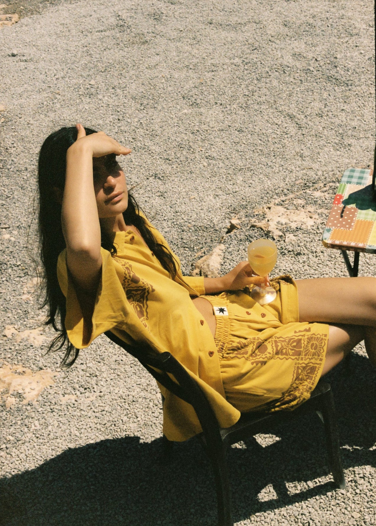 Women wearing a yellow and brown sun crab matching button up shirt and boxer short set.