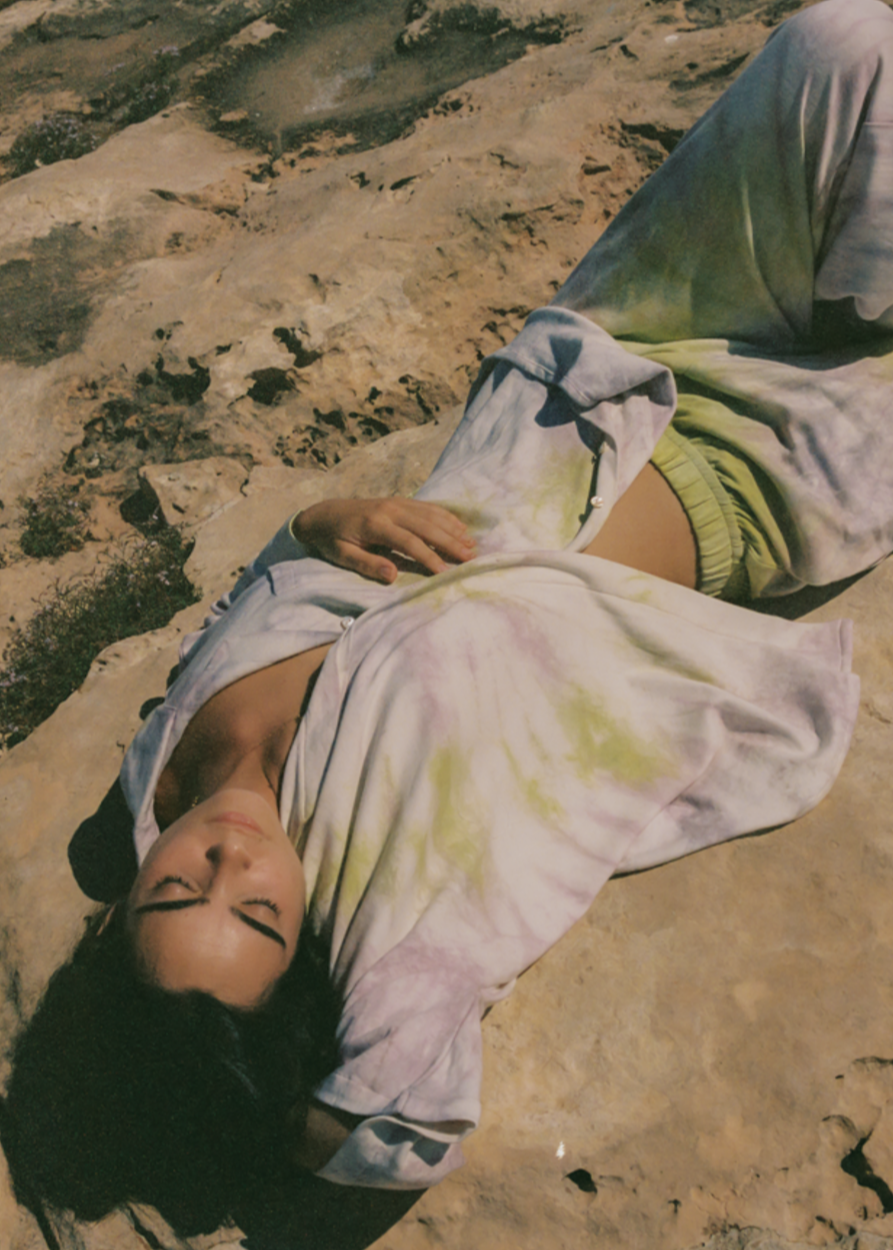 oversized tie-dye button up shirt with matching flowy fitting tie-dye pants.